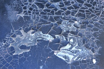 Paint cracking on the hood of a car. stock photo 