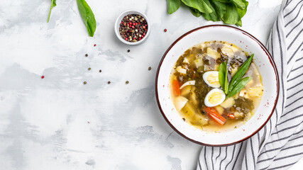 Green soup with sorrel and potatoes on a white background banner, menu recipe place for text, top view