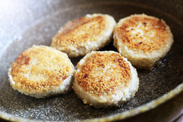 Fried cutlets in a frying pan