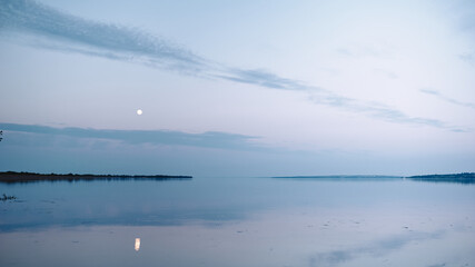 full moon rising over the river