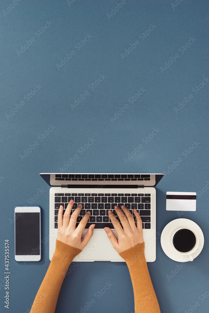 Wall mural Workspace with laptop, girl's hands.Flat lay computer