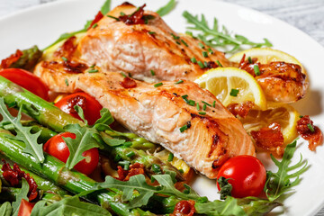 grilled salmon fillets with lemon, bacon,vegetables