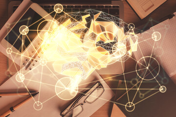 Double exposure of brain drawing over work table desktop. Top view. Global data analysis concept.