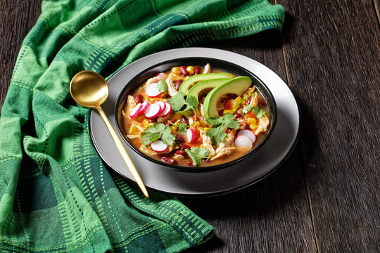 Mexican Chicken And Tortilla Soup On A Black Plate