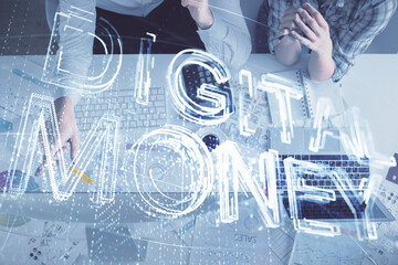 Double exposure of man and woman working together and crypto theme hologram drawing. Computer background. Blockchain concept. Top View.