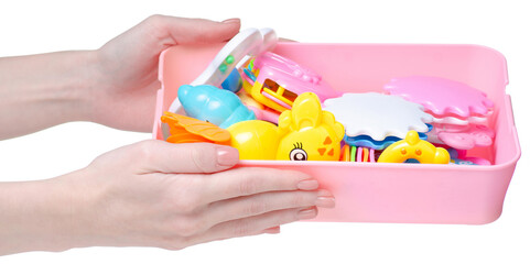 toy rattle in hand on white background isolation