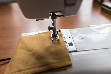 Production line sewing machine. Needle and footstep detail