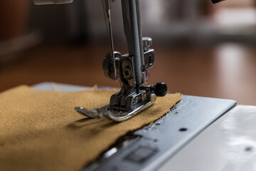 Production line sewing machine. Needle and footstep detail