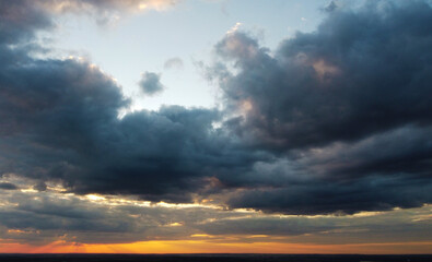 Beautiful contrasting clouds in the sky at sunset. Background for design