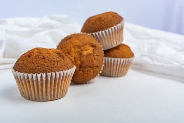 cupcakes against a white cloth copy space