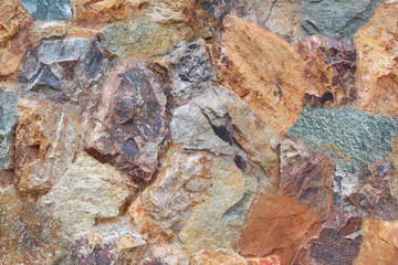 Rock wall with different sizes and colors.