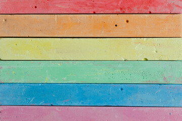 Baby colored crayons for drawing in the form of the LGBT rainbow flag. Beautiful rainbow colorful...