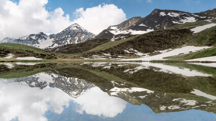 Naklejka na ściany i meble Alps landscape with reflections, Orobie mountains, Italy