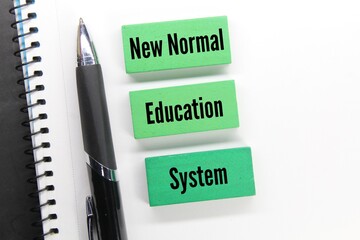 pens and green wood blocks with the new normal education system