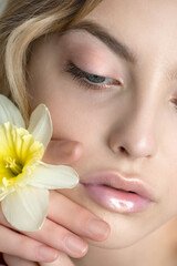 Close up face of fashion model with  professional holographic, radiant lip make-up.