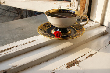 vintage cup of tea. vintage cup on the old window