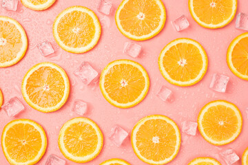 Top view photo of orange slices ice cubes and drops on isolated pastel pink background