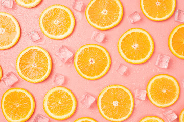 Top view photo of orange slices ice cubes and drops on isolated pastel pink background