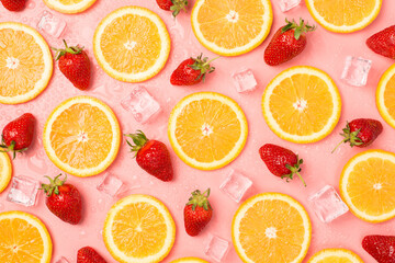 Top view photo of strawberries orange slices ice cubes and water drops on isolated pastel pink background