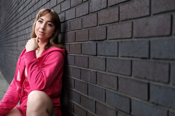 Portrait of young woman in active wear looking away.