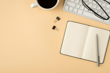 Top view photo of cup glasses on keyboard open grey reminder pen and binders on isolated beige...