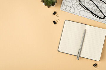 Top view photo of plant glasses on keyboard open grey reminder pen and binders on isolated beige background with copyspace