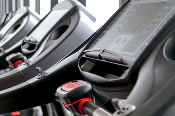 Obraz na płótnie Canvas Detail image of Treadmill in fitness room background 