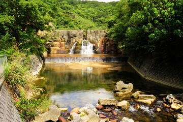 Waterfall and creek at Yambaru National Park in Okinawa, Japan - 沖縄 やんばる国立公園 川と滝 - obrazy, fototapety, plakaty
