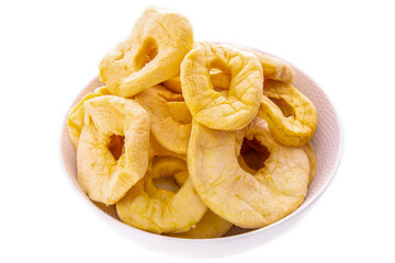 dried apple rings in a white bowl close-up.isolated food products
