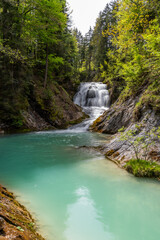 Fototapeta na wymiar Idyllischer Wasserfall Obernachkanal bei Wallgau in Oberbayern
