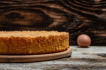 Homemade sponge cake or chiffon cake with ingredients on wooden table. Bakery background concept. banner, menu recipe place for text