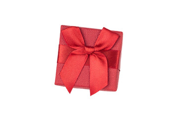 Red gift with a bow on a white background.