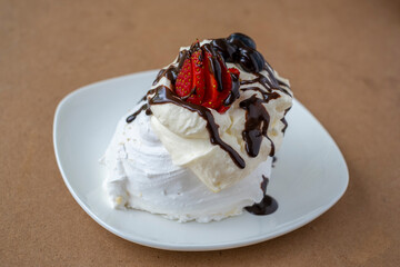 Delicious Pavlova with fresh berries and chocolate