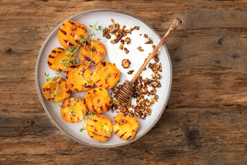 Grilled apricots with Greek yogurt, granola and honey. Summer breakfast