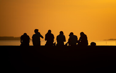 Fototapeta na wymiar people at sunset