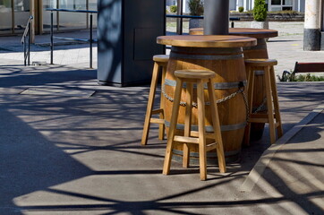 Street view with a place for relaxation equipped with a wooden barrel and wooden chairs, Sofia, Bulgaria 