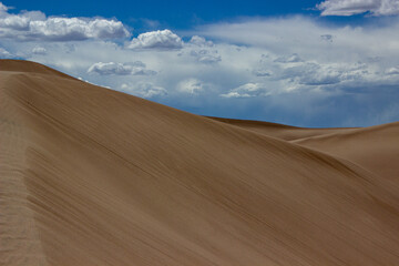 Fototapeta na wymiar Sand Dunes and Clouds