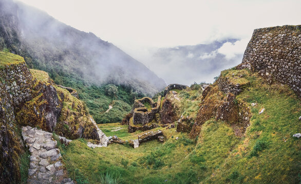 Human panoramic high angle view of Phuyupatamarca ruins. Inca trail to Machu Picchu archaeological site from the Inca's ancient civilization in Peru. South America