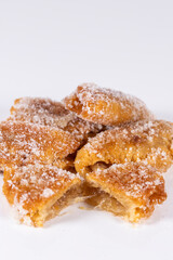 Fried sweet (borrachuelo) stuffed with angel hair, a typical Spanish dessert from Andalusia. Ideal for Christmas and Easter. Vertical shot and selective focus.