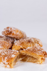 Fried sweet (borrachuelo) stuffed with angel hair, a typical Spanish dessert from Andalusia. Ideal for Christmas and Easter. Vertical shot and selective focus.