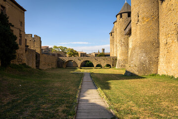 Fototapeta premium Stone bridge with arches leading to the castle from the medieval fortified citadel of Carcassonne, France