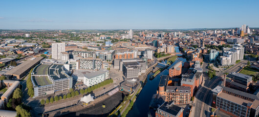 Aerial view of Leeds city centre on a sunny day looking west from near the docks  towards the...