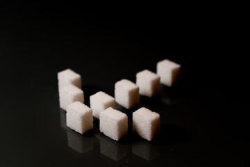 Sugar cubes in different arrangements and colored light. Bavaria Germany . Arrow, Pile, Cube, Square,