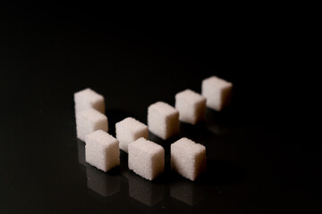 Sugar cubes in different arrangements and colored light. Bavaria Germany . Arrow, Pile, Cube, Square,