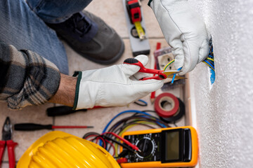 Electrician at work on a residential electrical system. Electricity.