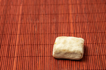 Typical Christmas sweet (Hojaldrina) similar to polvorón and mantecado, made with layers of puff pastry inside. Horizontal shot and selective focus