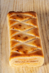 (Pan de Cadiz) Typical sweet from Andalusia, Spain. Baked dessert of marzipan dough filled with candied fruit. Vertical shot and selective focus.