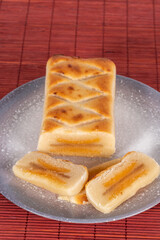 (Pan de Cadiz) Typical sweet from Andalusia, Spain. Baked dessert of marzipan dough filled with candied fruit. Vertical shot and selective focus.