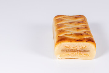 (Pan de Cadiz) Typical sweet from Andalusia, Spain. Baked dessert of marzipan dough filled with candied fruit. Horizontal shot and selective focus.