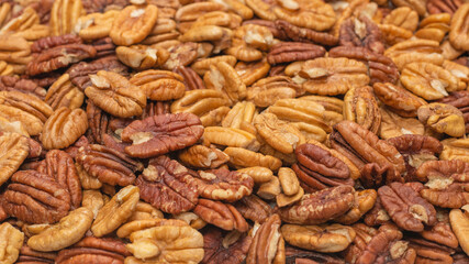 Tasty pecan-nut background. Top view.